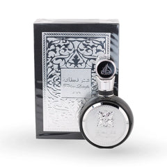 Fakhar Lattafa Black perfume bottle with ornate silver packaging