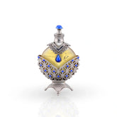 Hareem Al Sultan Blue perfume oil in silver bottle with sapphire gems