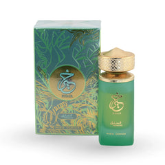 Khair Pistachio perfume in green gradient bottle with ornate gold filigree cap and tropical leaf packaging