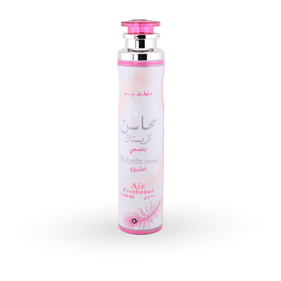 Air freshener bottle with pink cap and decorative elements on a white background