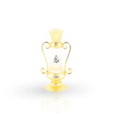 Golden Naema bottle with ornate handle design