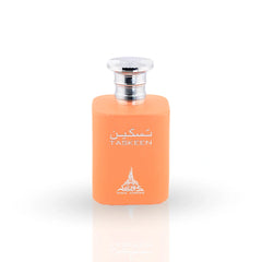 Taskeen perfume in vibrant orange bottle with silver cap and floral patterned packaging