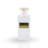 White perfume bottle with gold cap on a white background