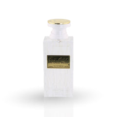 White perfume bottle with gold cap on a white background
