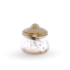 Glass jar with a gold lid on a white background