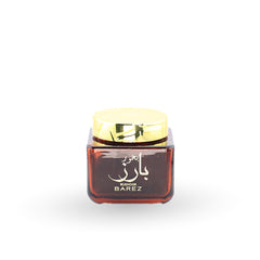 Small container with a gold lid on a white background