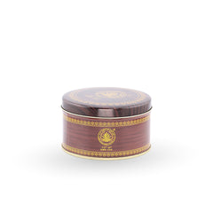 Round brown container with gold decorative elements on a white background