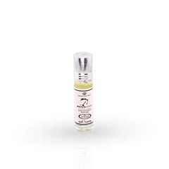 Small perfume bottle with a white label on a white background