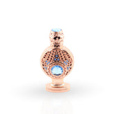 Rose gold decorative bottle with blue gemstones on a white background