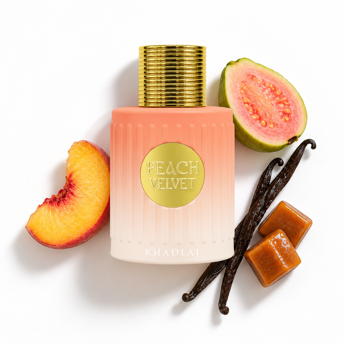 Khadlaj Peach Velvet 100ml bottle with peach, guava, vanilla pods and caramel on a white background