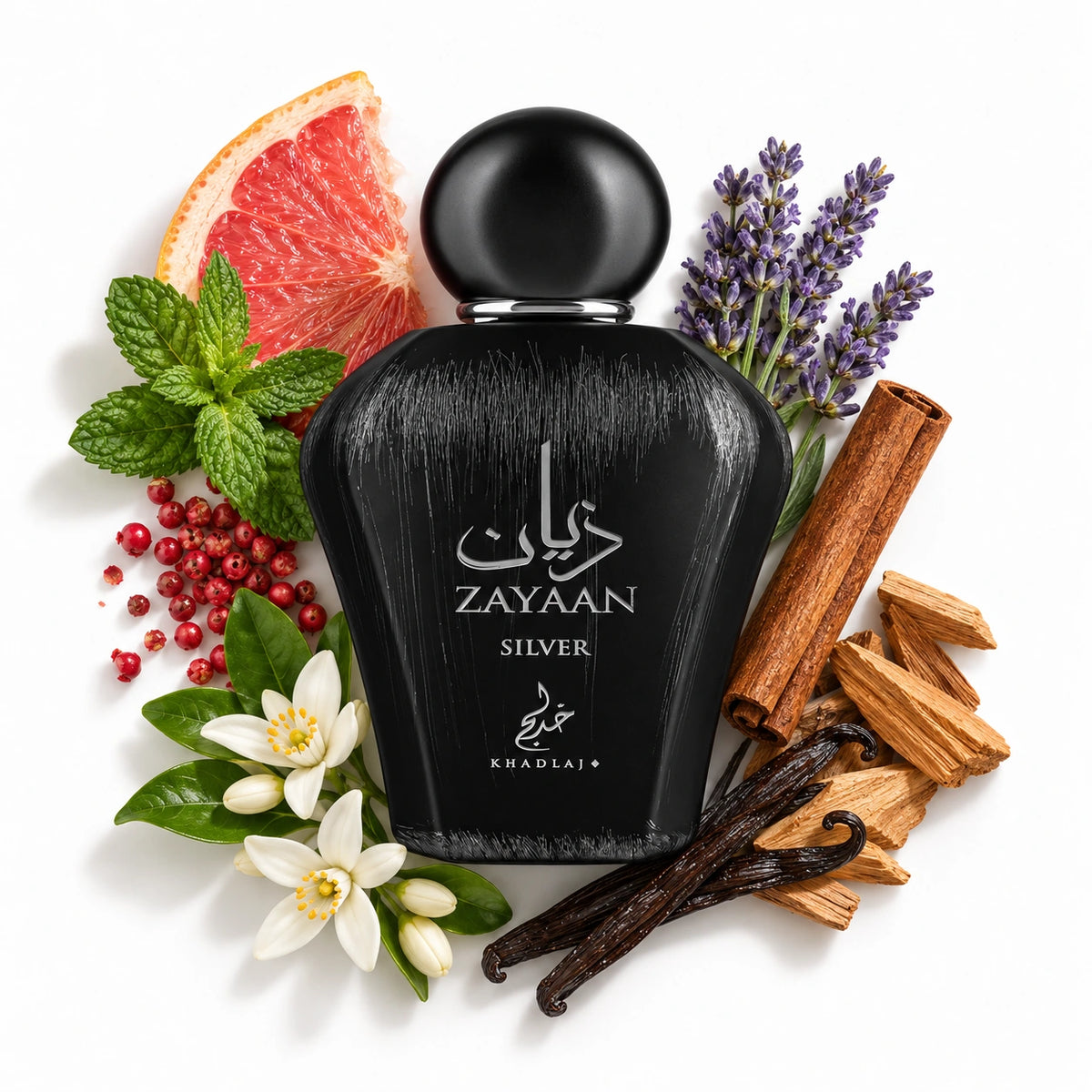 Khadlaj Zayaan Silver 100ml eau de parfum bottle laid flat on white with grapefruit and mint and fragrance-note ingredients