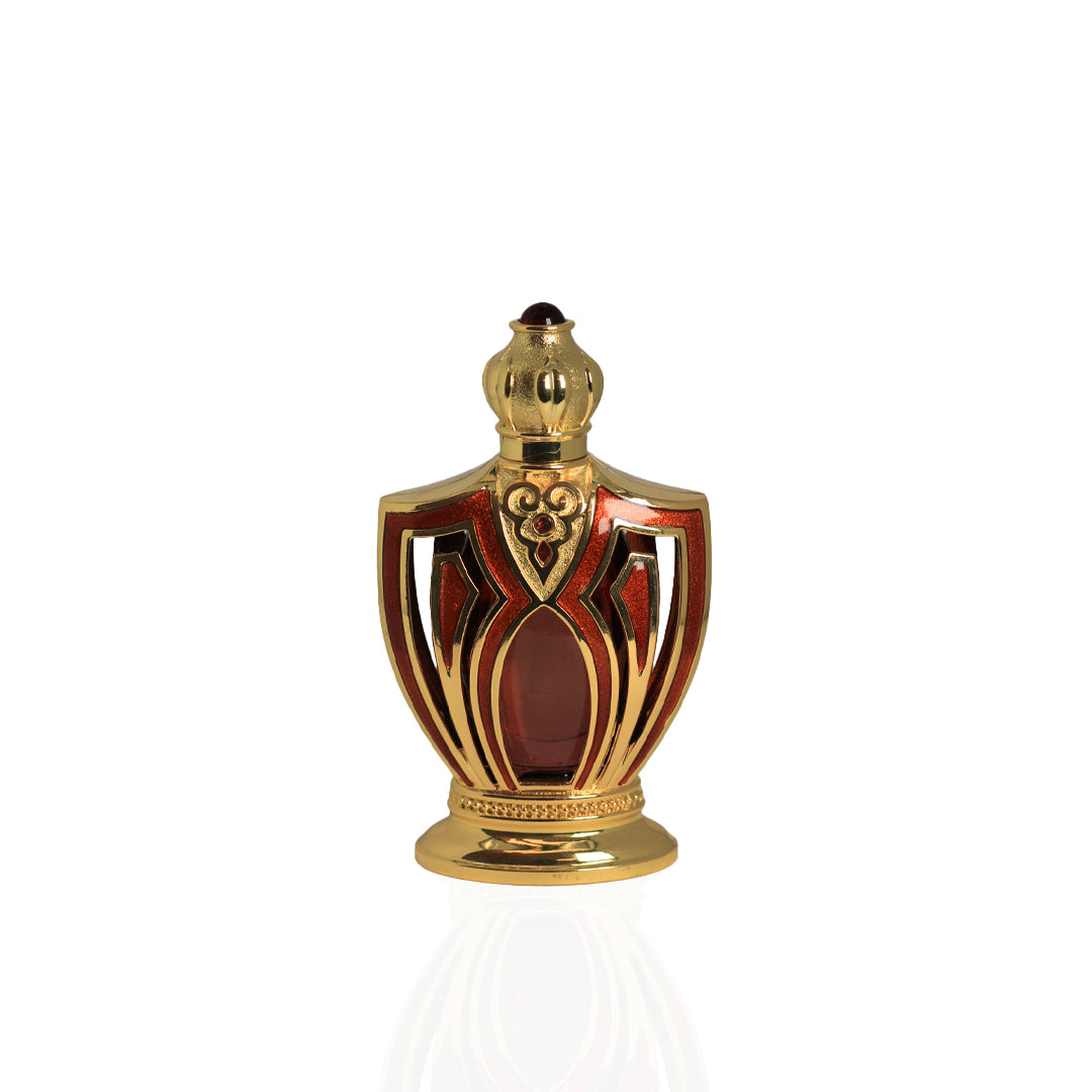 Decorative bottle with gold and red design on a white background