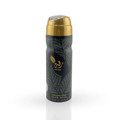 Perfumed spray bottle with gold cap on a white background