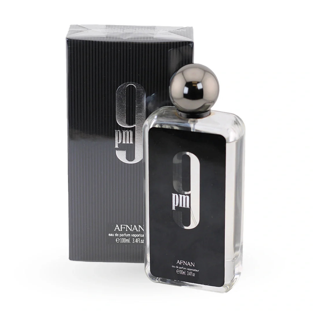 Afnan 9 PM Eau de Parfum 100ml — clear glass bottle beside its dark charcoal ribbed presentation box
