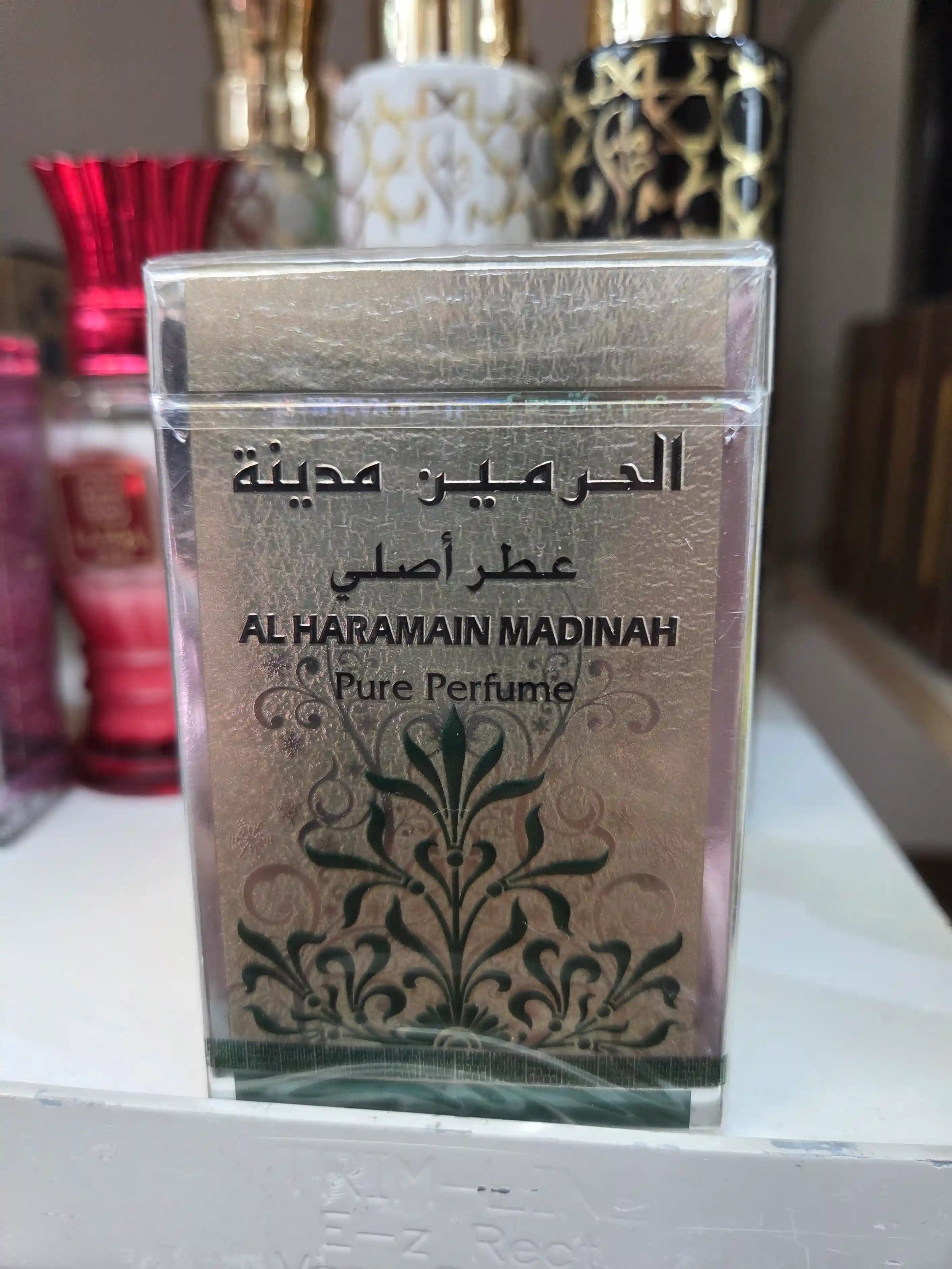 Al Haramain Madinah Pure Perfume bottle with elegant floral design
