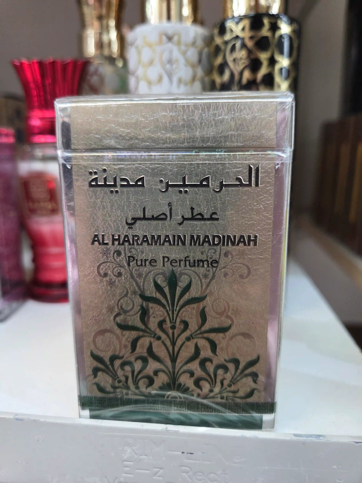 Al Haramain Madinah Pure Perfume bottle with elegant floral design