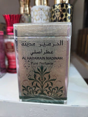 Al Haramain Madinah Pure Perfume bottle with elegant floral design