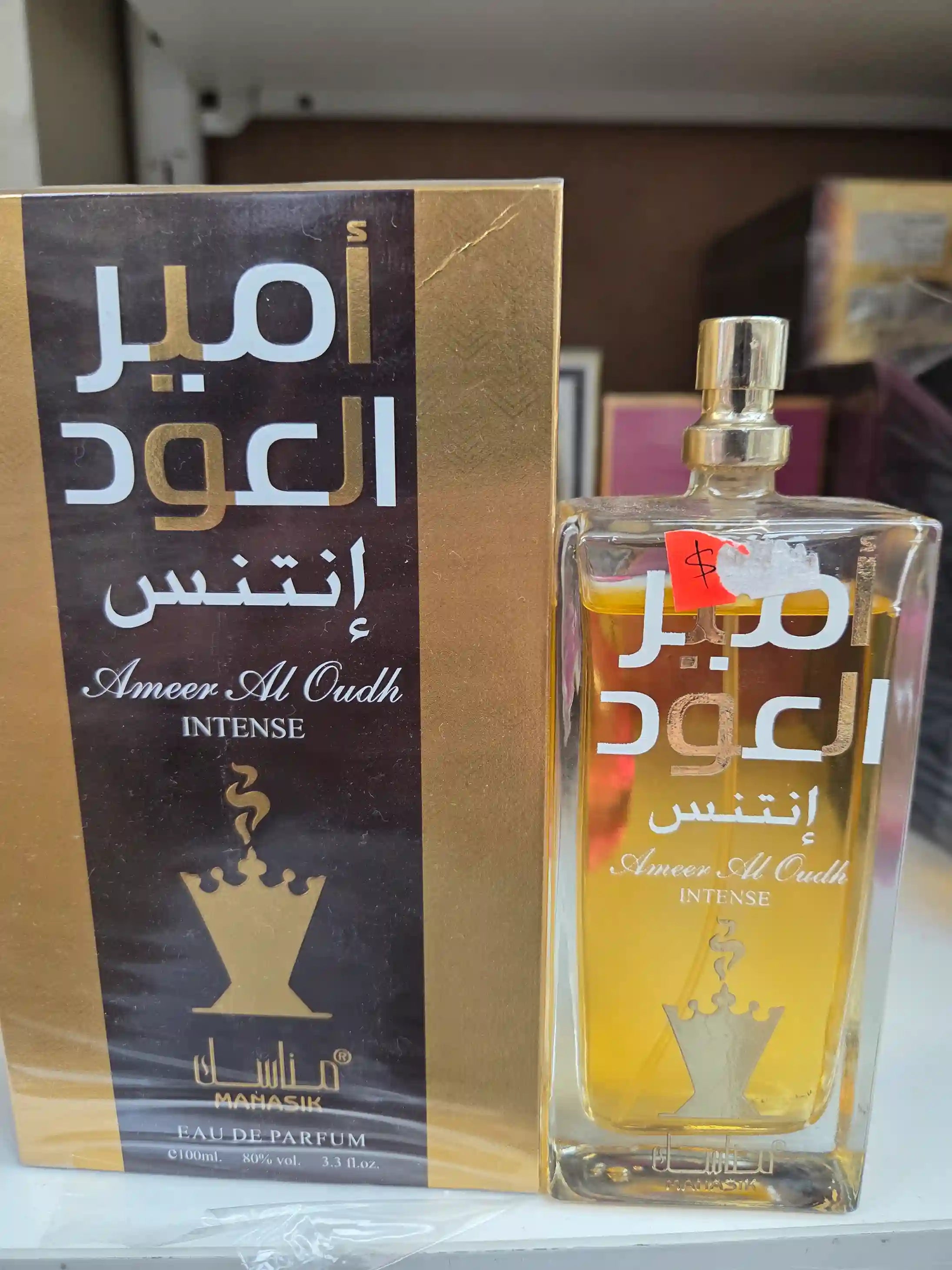 Ameer Al Oudh Intense perfume 100ml with black and gold packaging by Mahasik