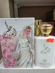 Attar Al Aroussa bridal perfume 100ml with rose packaging and golden cap