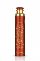 Red and gold air freshener bottle with geometric patterns on a white background