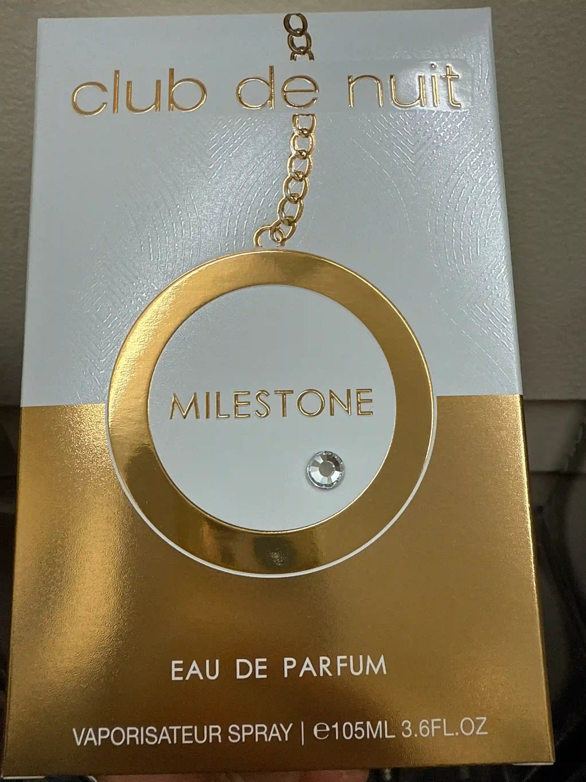 Club de Nuit Milestone 105ml gold perfume bottle with chain