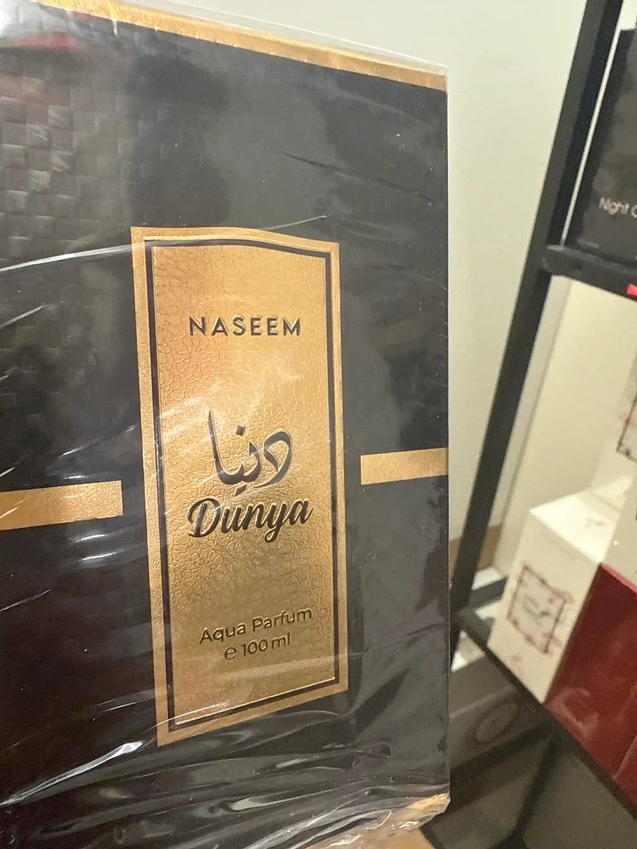 Dunya Naseem 100ml Aqua Parfum in black packaging with gold label
