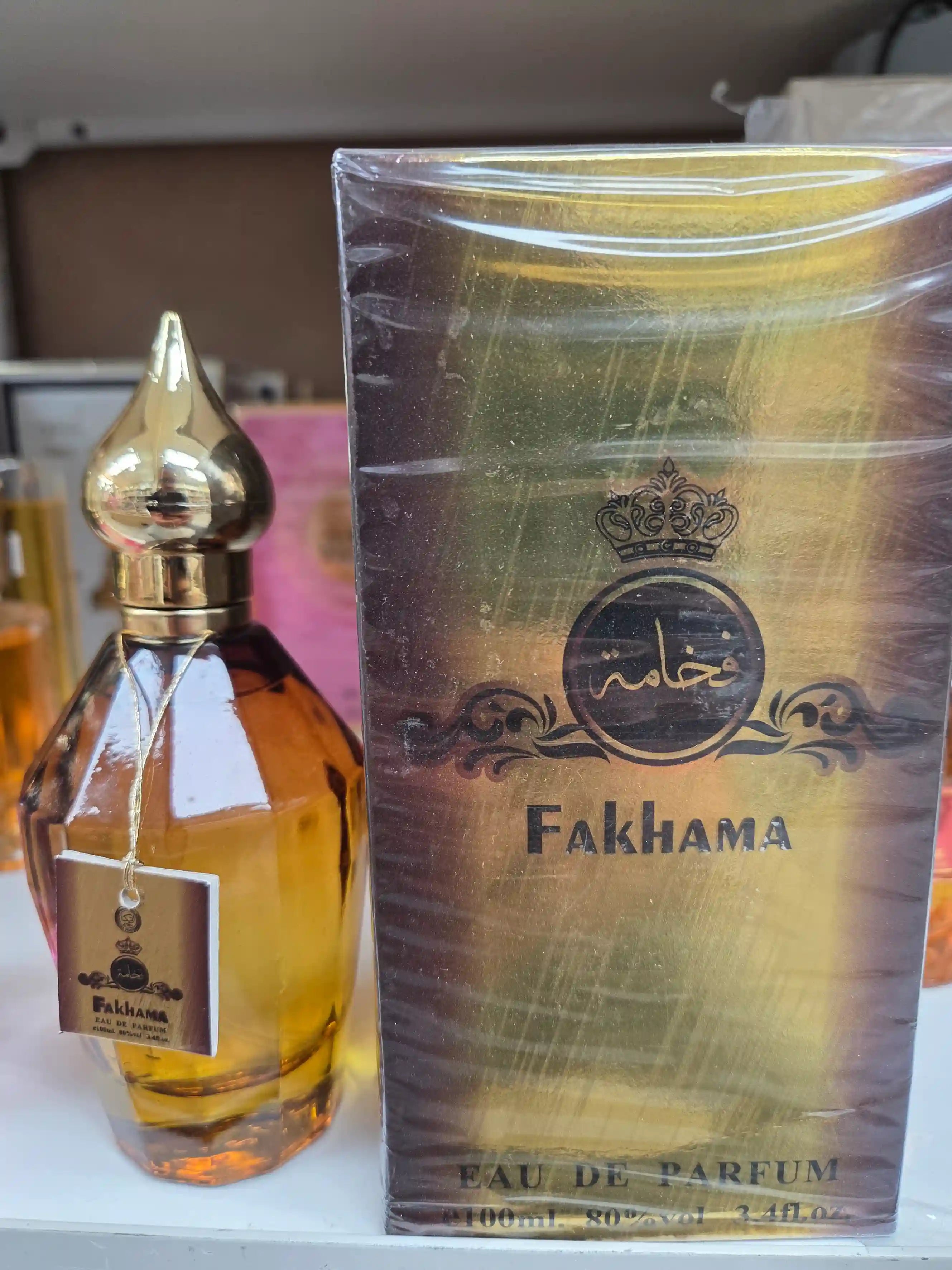 Fakhama 100ml Eau de Parfum bottle with golden cap and packaging