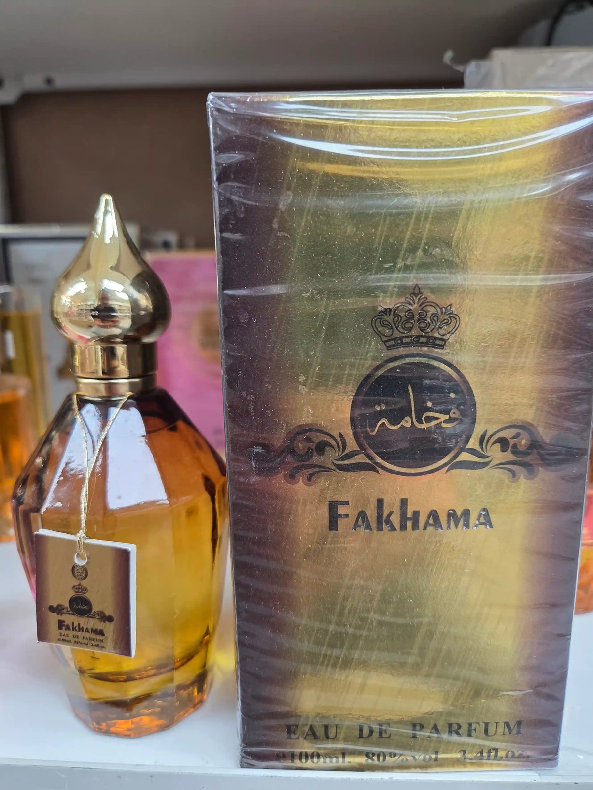 Fakhama 100ml Eau de Parfum bottle with golden cap and packaging