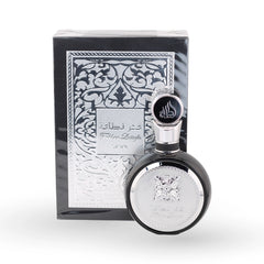 Fakhar Lattafa Black perfume bottle with ornate silver packaging