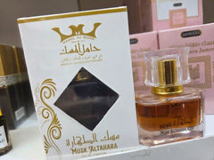 Hamil Al Musk Altahara Arabic perfume bottle with gold packaging