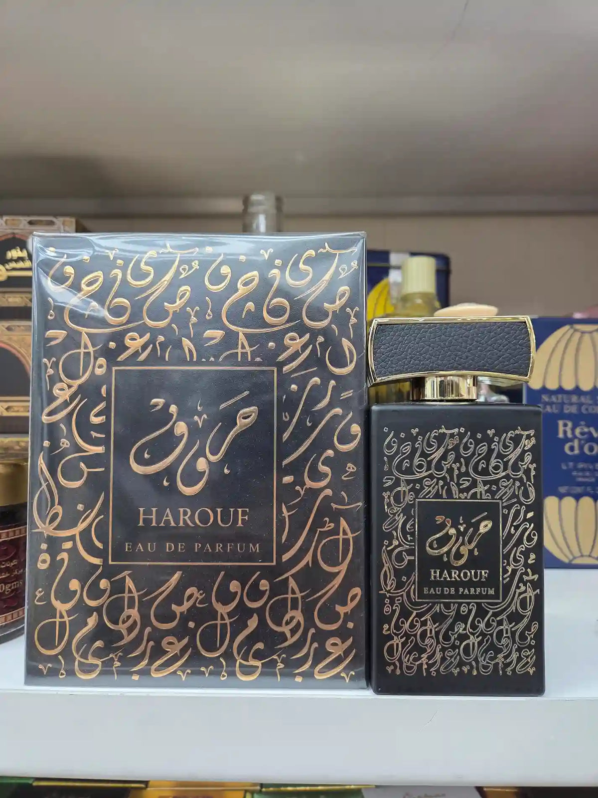 Harouf Eau de Parfum bottle with gold Arabic calligraphy on black packaging