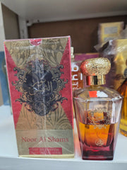 Noor Al Shams 100ml perfume bottle with ornate golden cap