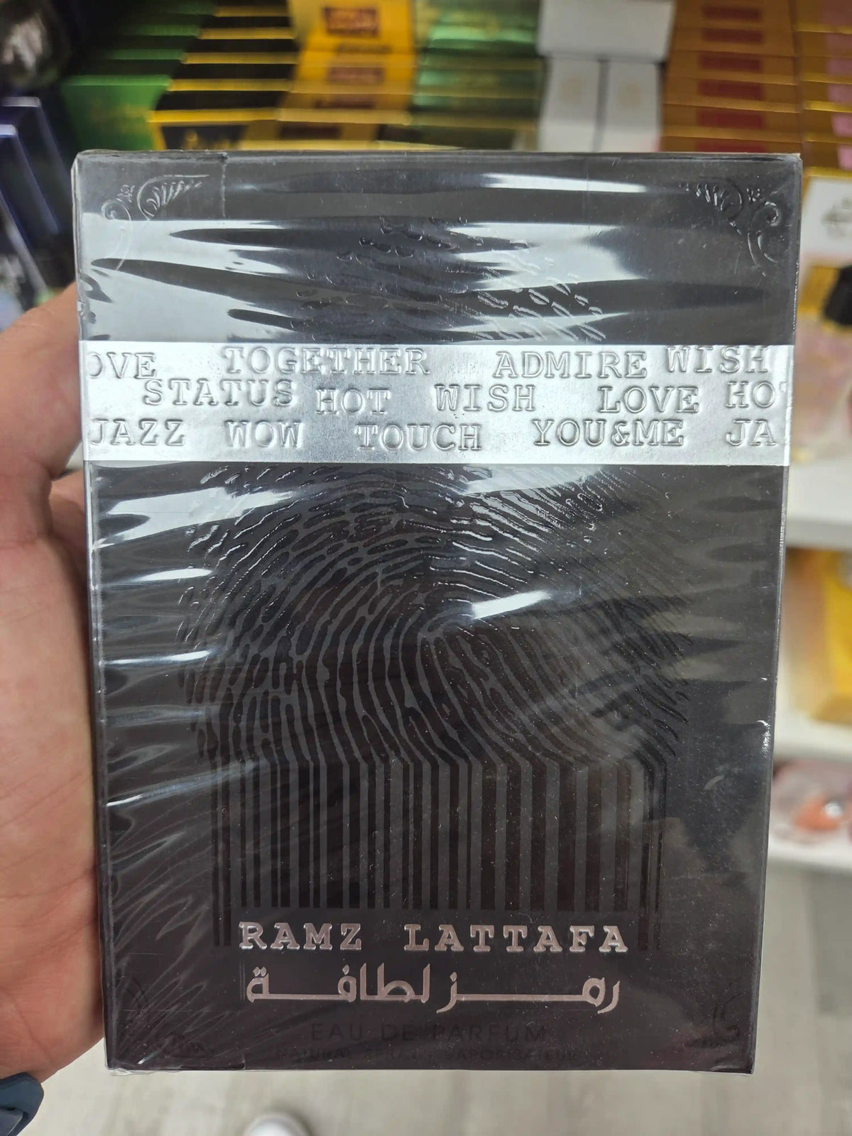 Ramz Lattafa perfume box textured black silver design