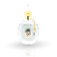 Rouat Al Oud perfume bottle by Lattafa with ornate crystal design and gold cap