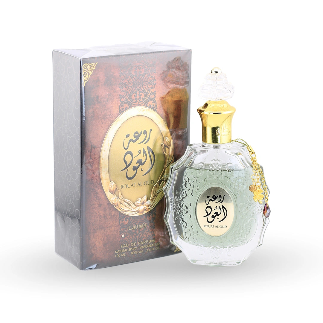Rouat Al Oud perfume bottle by Lattafa with ornate crystal design and gold cap