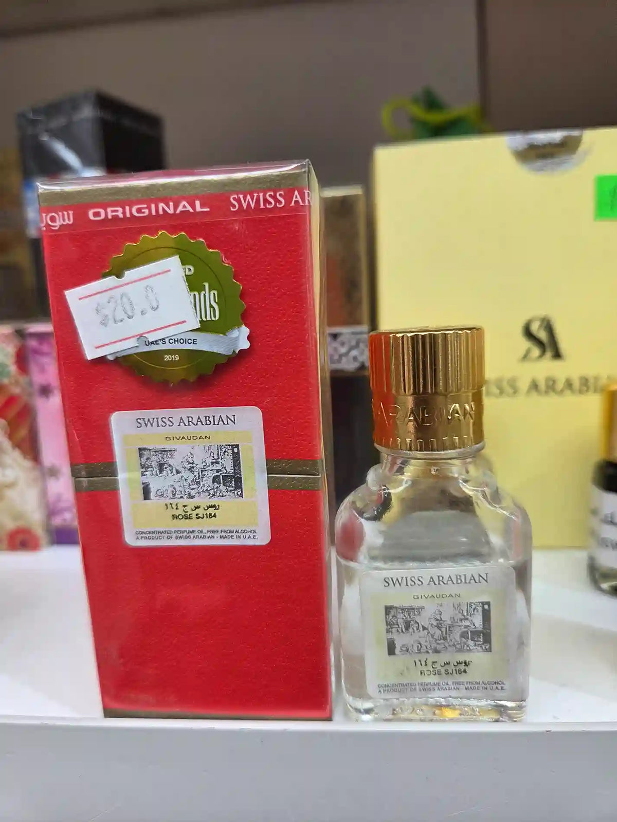 Swiss Arabian Rose SJ184 perfume oil bottle with red packaging