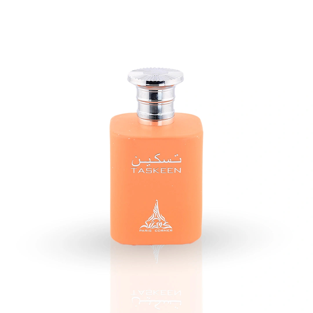 Taskeen perfume in vibrant orange bottle with silver cap and floral patterned packaging