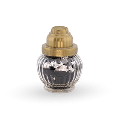 Small decorative bottle with a gold cap on a white background