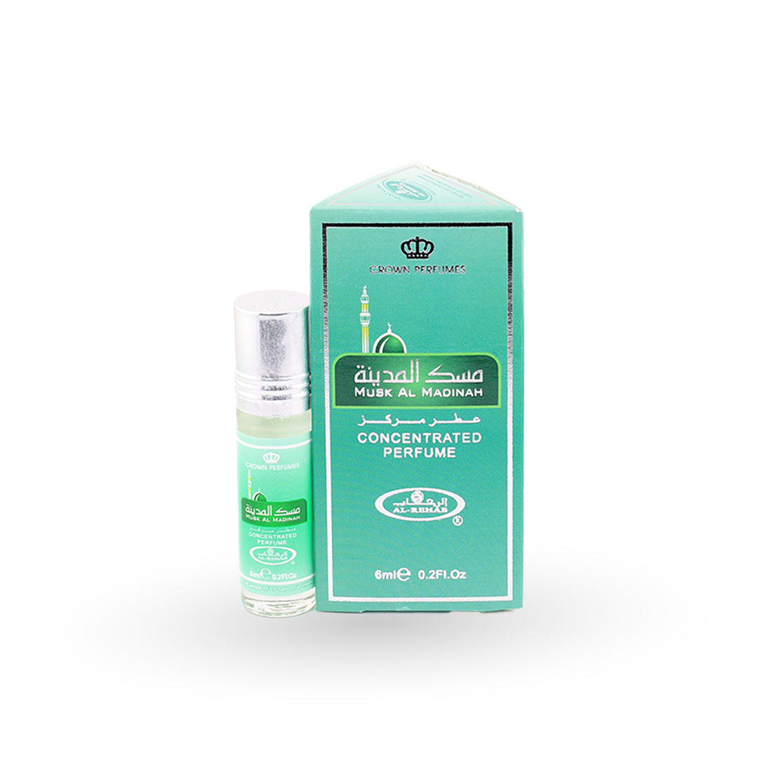 Perfume bottle and packaging with 'Musk Al Madinah' branding on a white background