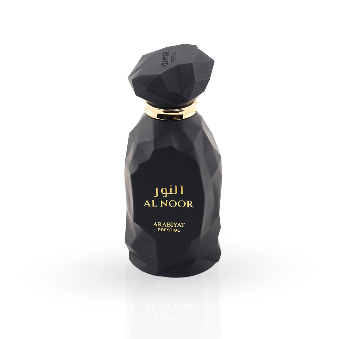 Black perfume bottle with gold cap and 'Al Noor' branding on a white background