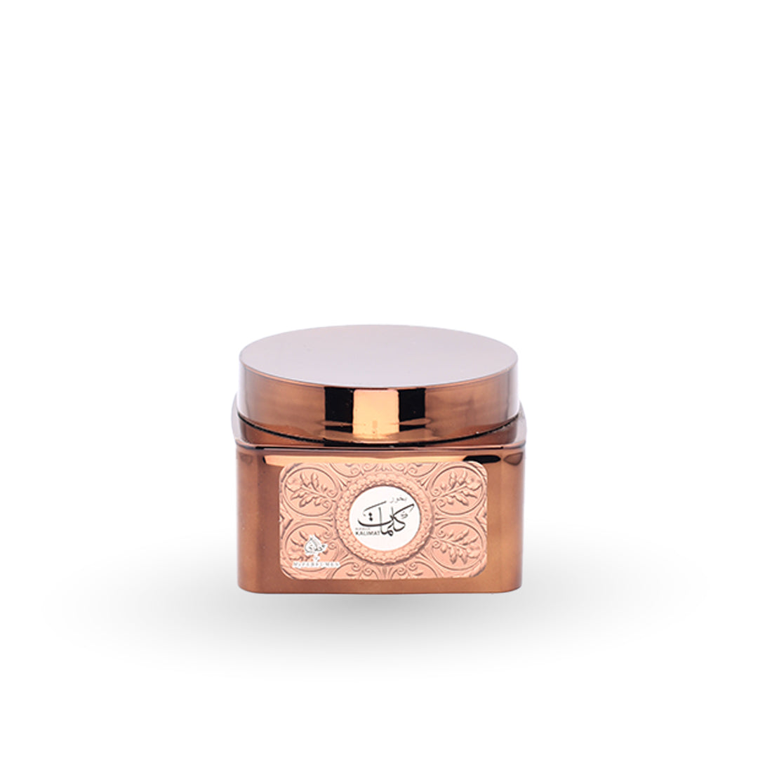 Rose gold container with decorative design on a white background