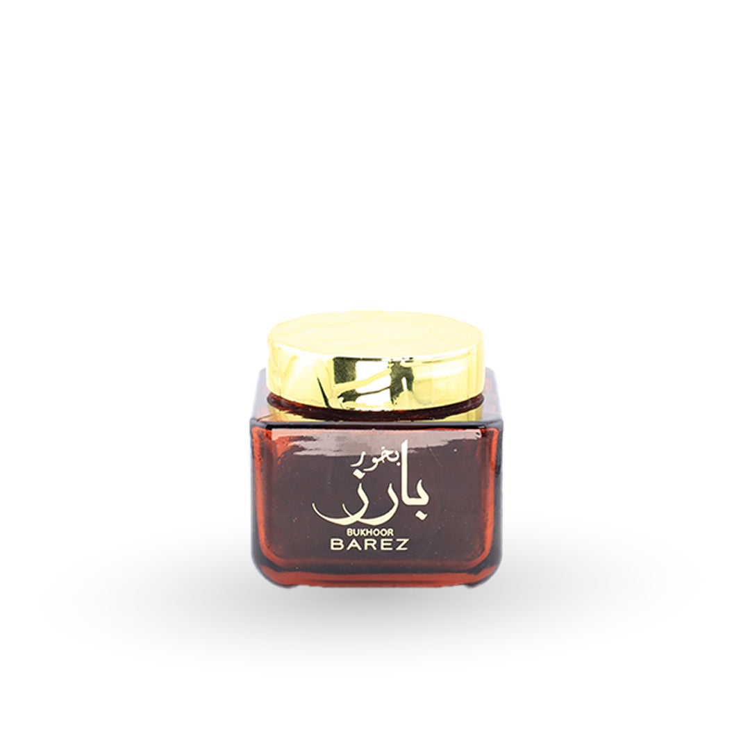 Small container with a gold lid on a white background