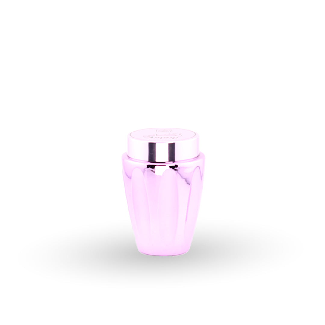 Pink glass bottle with silver cap on a white background