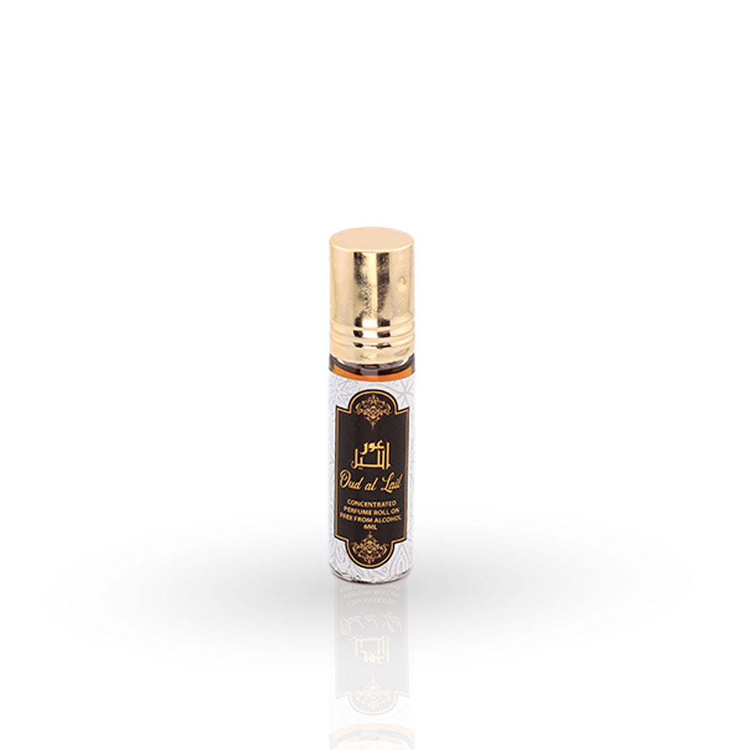Roll-on perfume bottle with gold cap on a white background