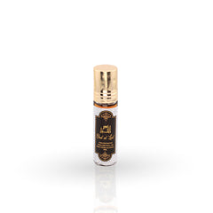 Roll-on perfume bottle with gold cap on a white background