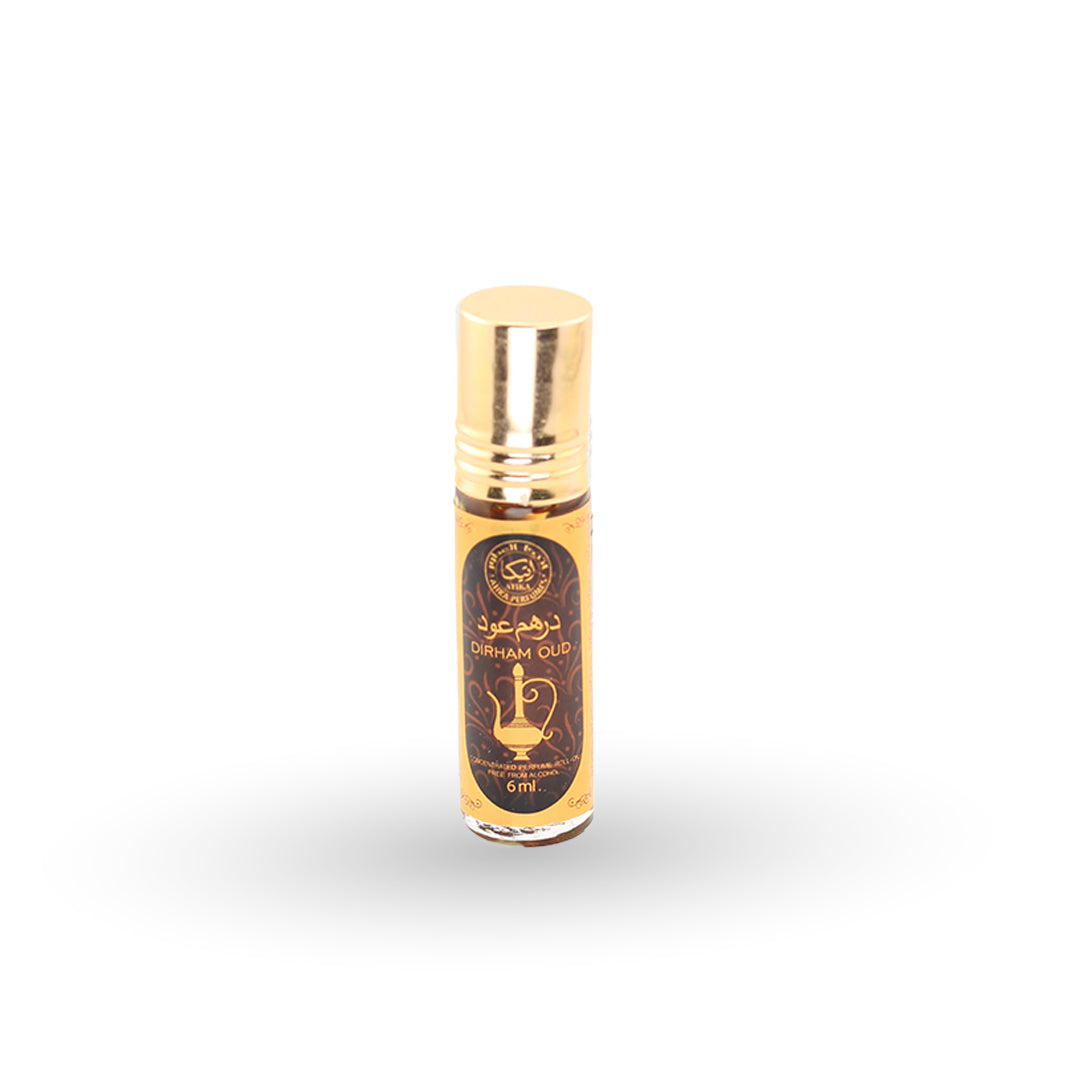 Small gold and black bottle on a white background