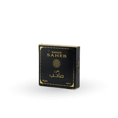 Black and gold box of Bukhoor Saheb on a white background