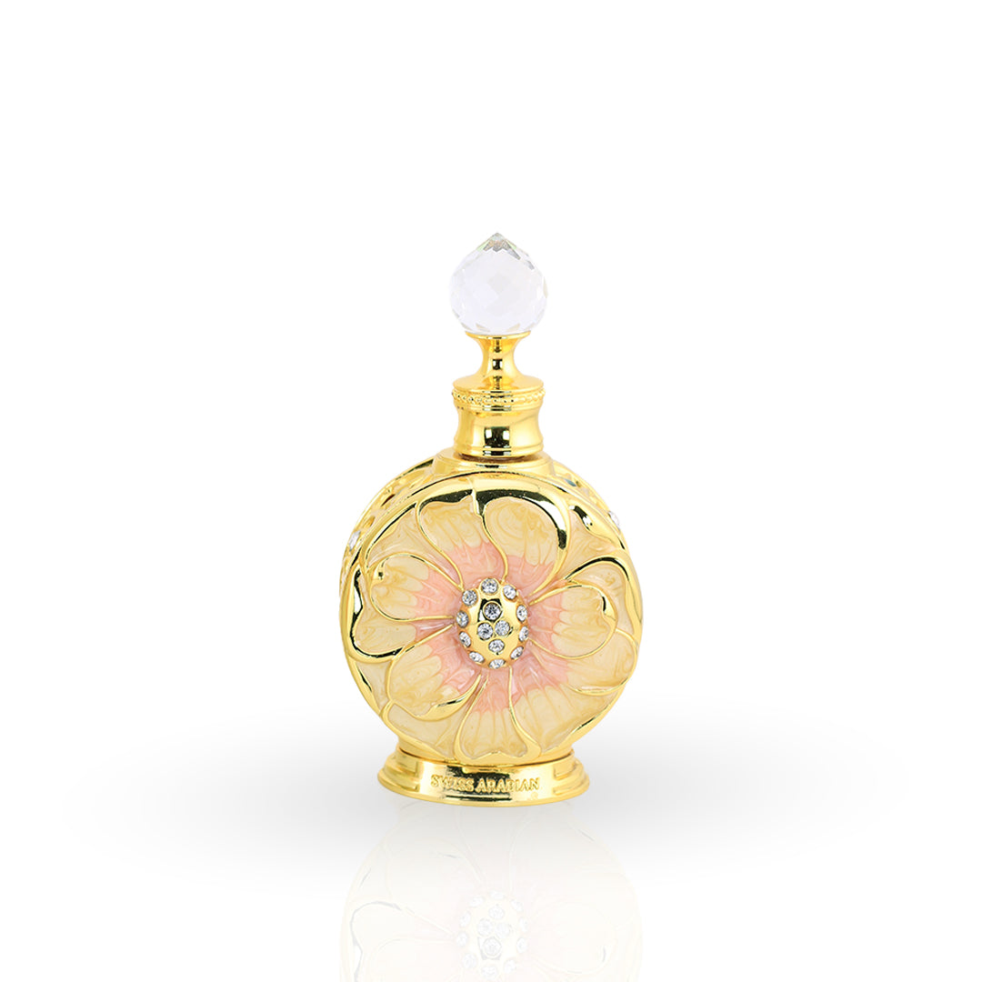 Gold and pink perfume bottle with decorative elements on a white background