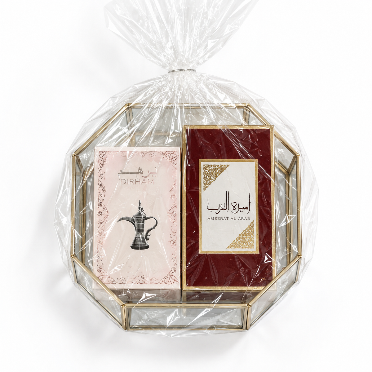 Ameerat Al Arab gift basket with its two closed boxes in the mirrored presentation tray on white.