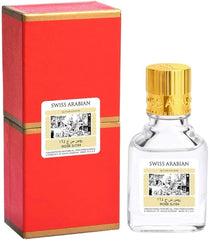 Clear glass perfume oil bottle with gold cap and red vintage-style packaging